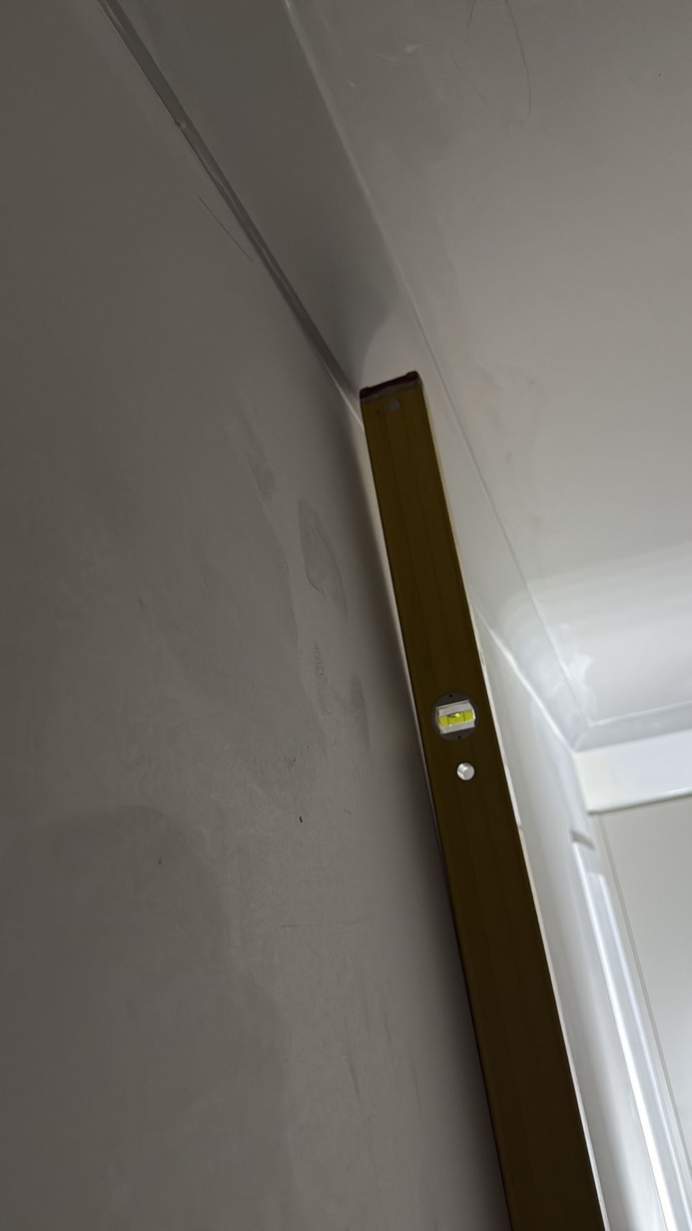 Walls bowed or out of line by more than the allowed 5mm over a straight edge, found during a waterproofing inspection in Wollert