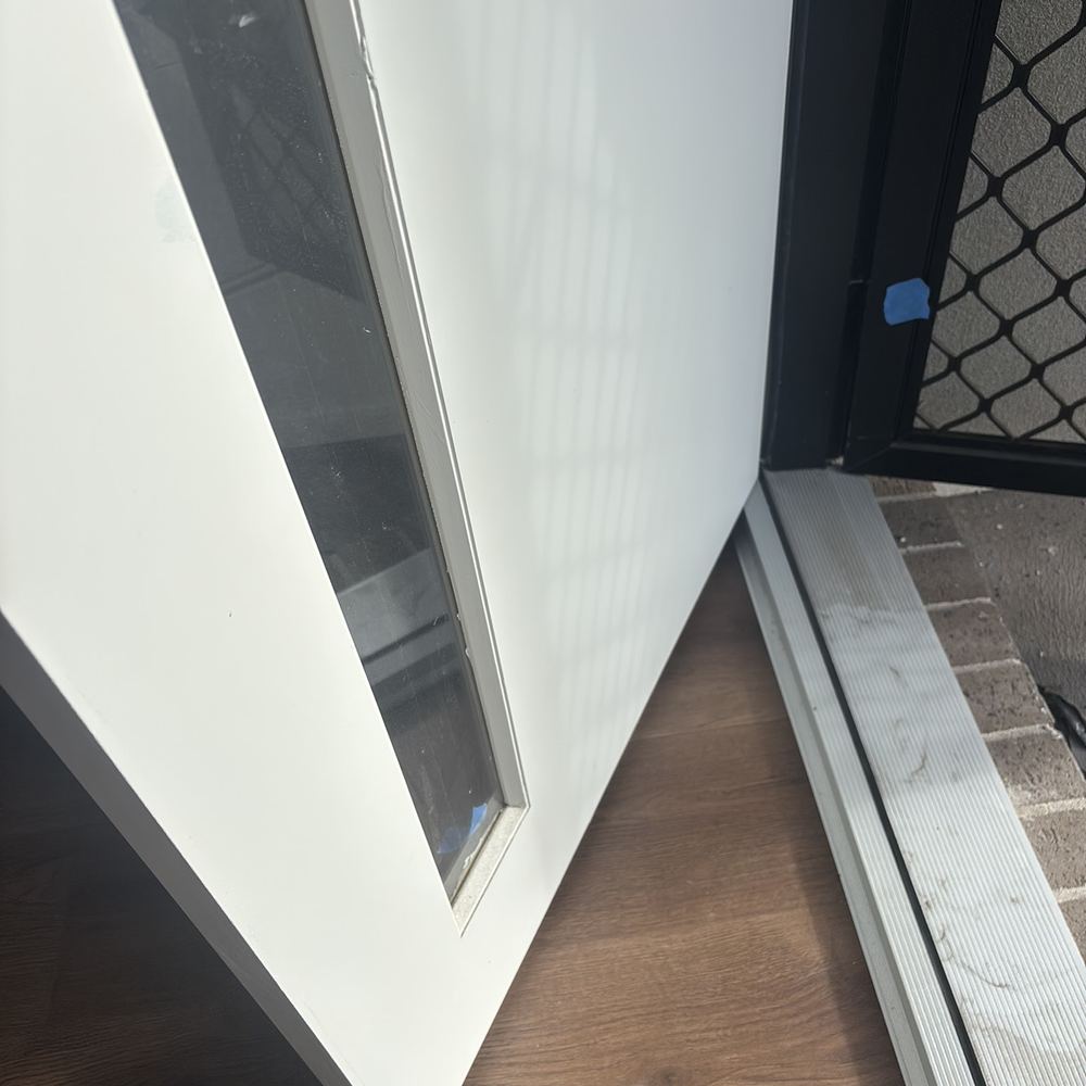 External glazed door fitted inside out, so the glass can be removed from outside, found during a practical completion inspection in Wollert