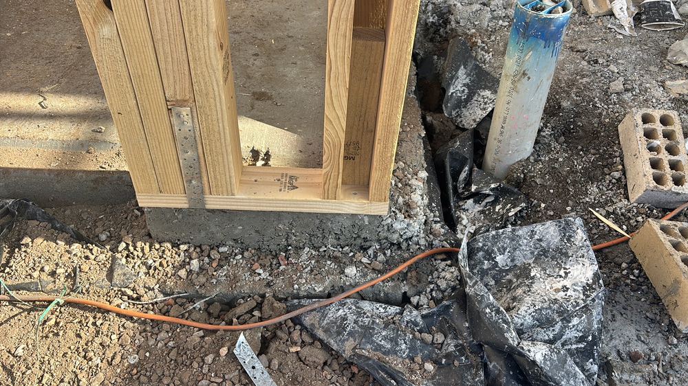 Honeycombing along the slab edge, which weakens the concrete and exposes the steel, found during a frame inspection in Wollert