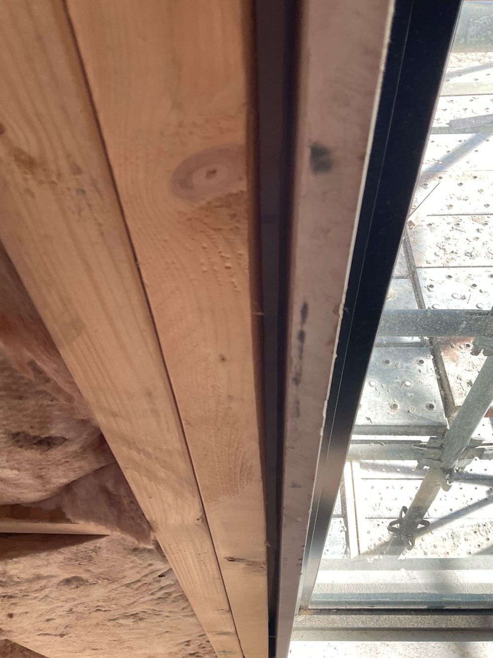 No insulation between the window reveal and the frame, letting air leak through, Wollert