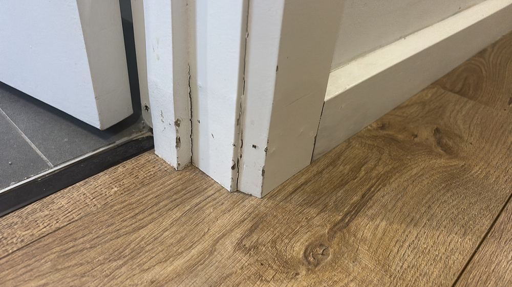 Floor around the only shower swollen and deformed from long standing moisture, found during a defect investigation inspection in Epping