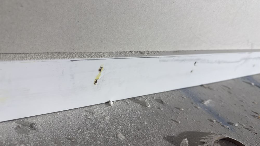 Skirting nail heads still to be filled and sanded before painting, found during a fixing inspection in Wollert