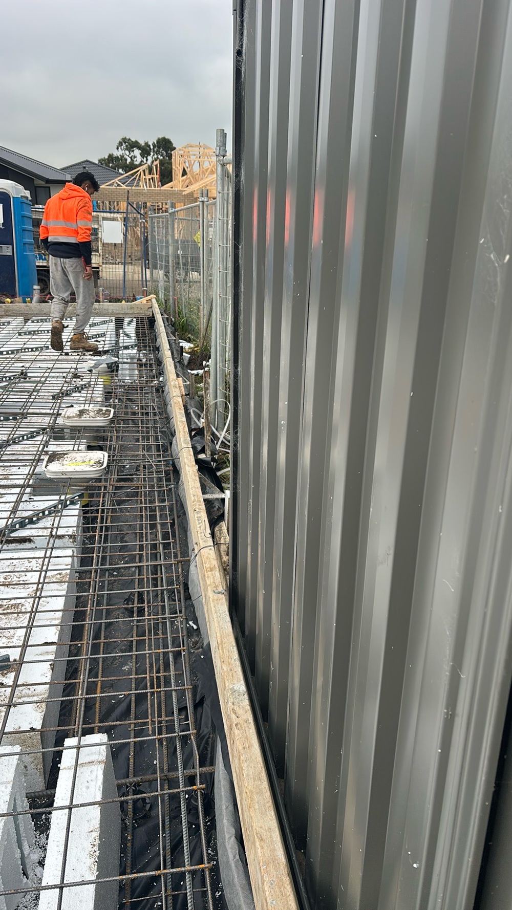 Formwork boards not straight, so the poured slab edge would not be true, found during a construction stage inspection in Wollert