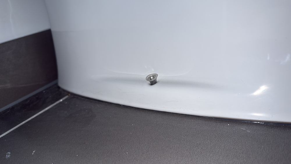 Toilet pan loose and not properly fixed to the floor, found during a practical completion inspection in Wollert