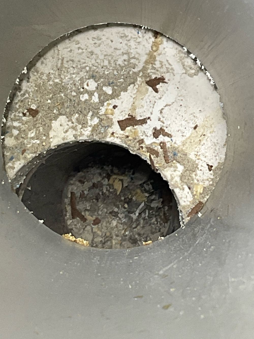 Broken waste pipe with debris inside that could block the sewer, Wollert