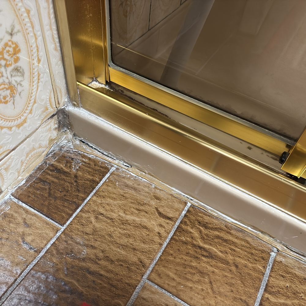 Shower screen and wall junctions needing proper sealing to keep water out, found during a building and pest inspection in Epping