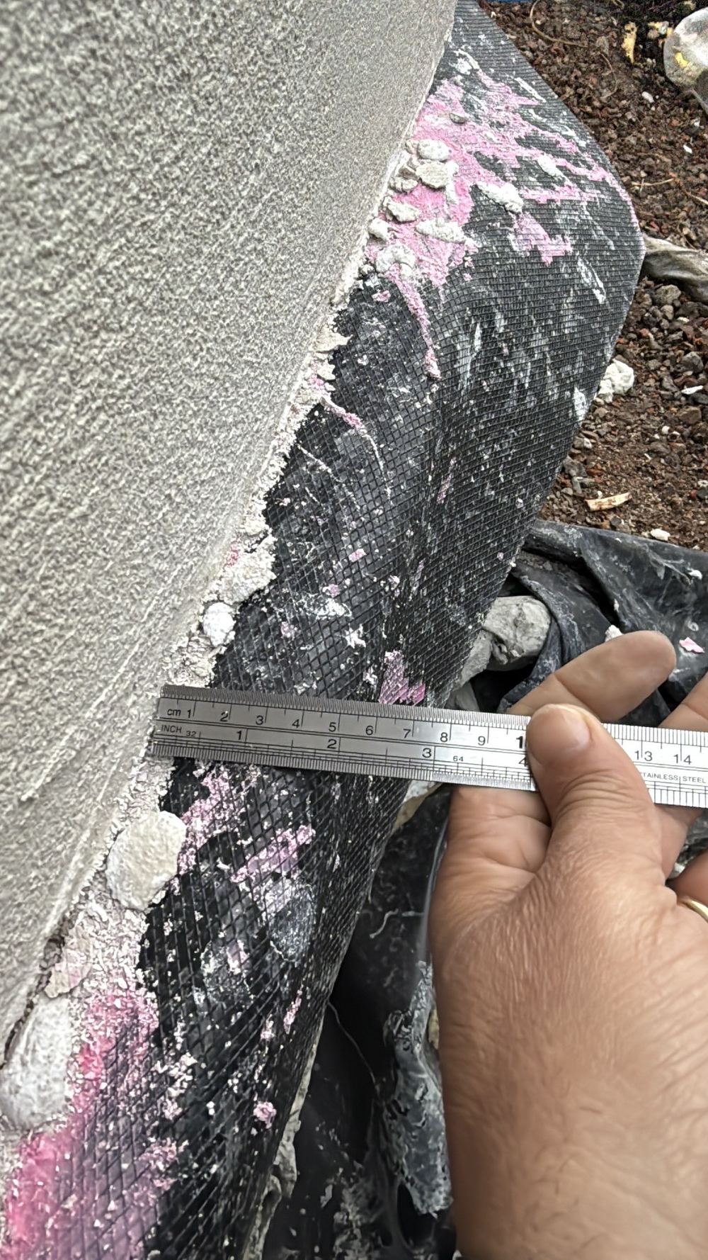 Concrete slab sitting past the cladding face and needing trimming back flush, Wollert